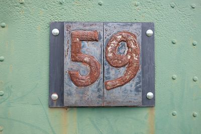 Close-up of rusty number 59