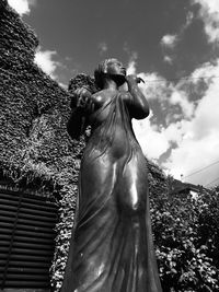 Low angle view of statue against sky