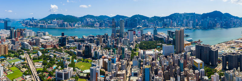 Aerial view of modern buildings in city against sky