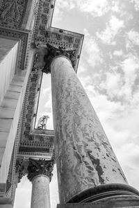 Low angle view of historical building against cloudy sky