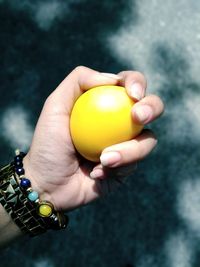 Close-up of hand holding apple