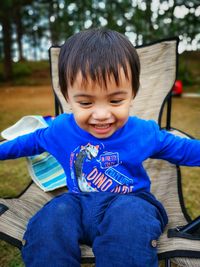 Cute boy sitting on seat