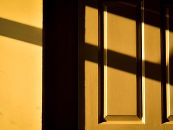 The sunset rays and shadows over the window 