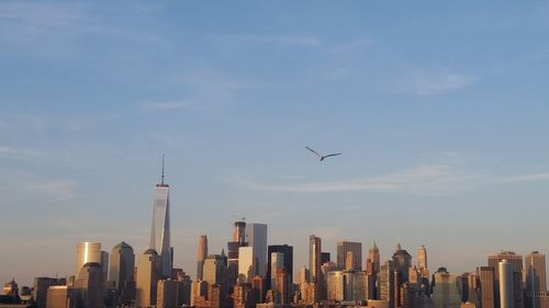 Modern buildings in city against sky