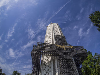 Low angle view of building against cloudy sky