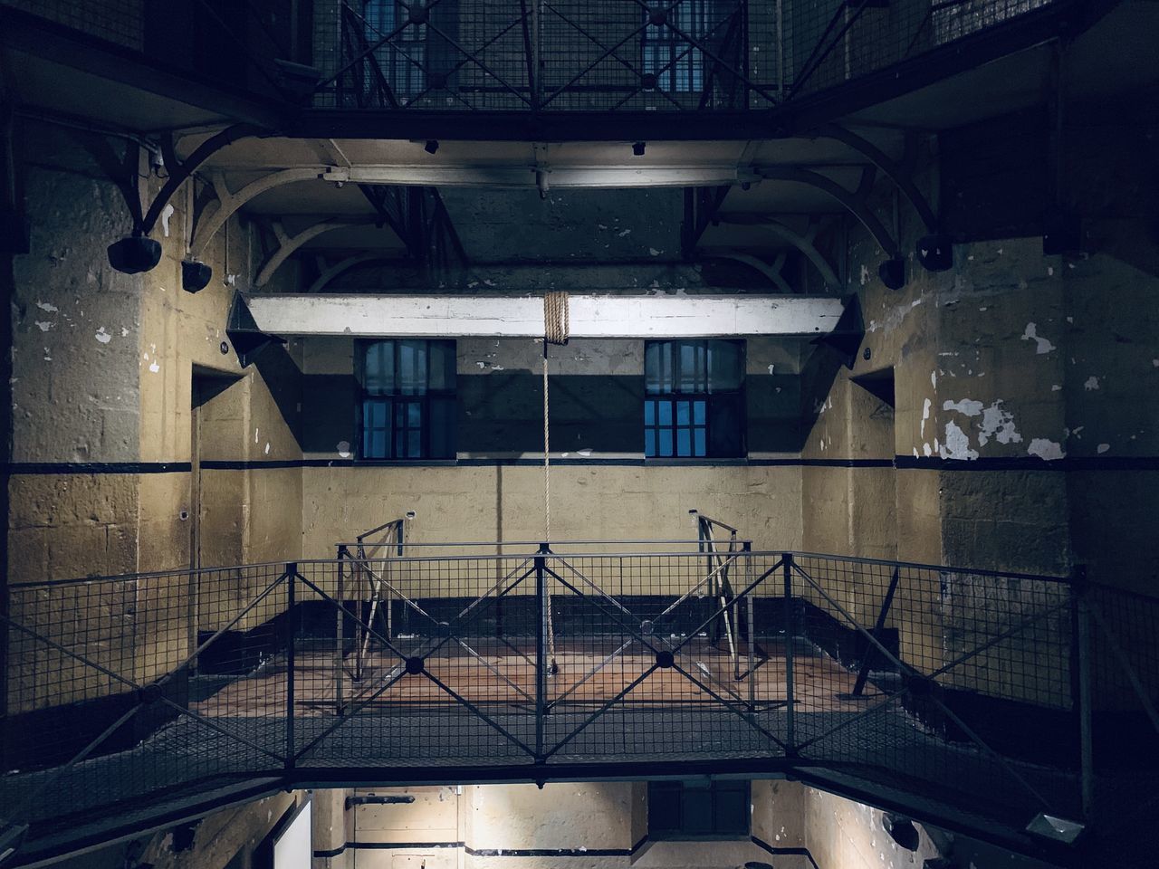 LOW ANGLE VIEW OF ILLUMINATED BUILDING INTERIOR