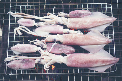 High angle view of meat on barbecue grill