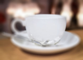 Close-up of coffee cup on table