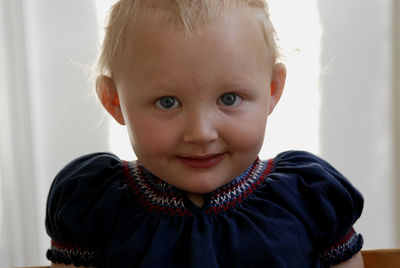 Portrait of cute baby girl at home