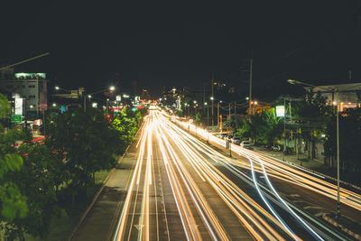 High angle view of light trails on city street at night