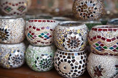 Close-up of multi colored pottery for sale in market