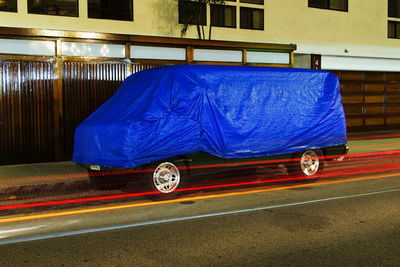 View of blue car on road