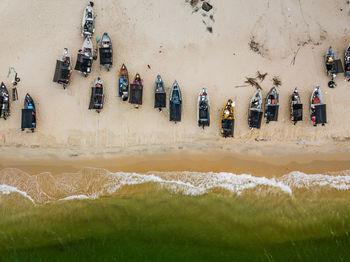 Aerial view of boats on sandy beach