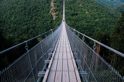 High angle view of footbridge over mountains