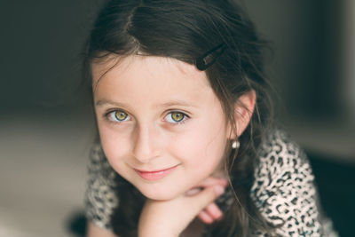 Close-up portrait of cute smiling girl