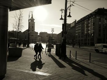 Silhouette of man walking in city