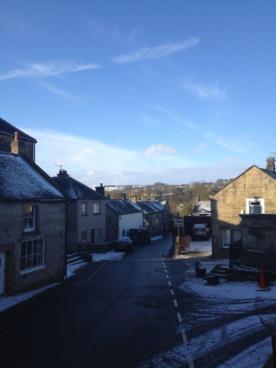 building exterior, architecture, built structure, house, residential structure, sky, residential building, street, town, residential district, road, blue, cloud, snow, cloud - sky, city, day, outdoors, the way forward, building