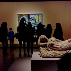 Rear view of people at museum