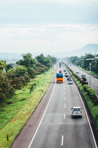 Cars on road against sky