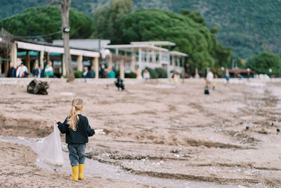 Full length of boy running on beach