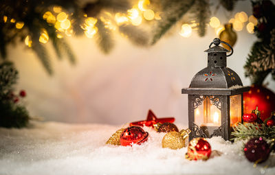 Close-up of christmas decorations on snow