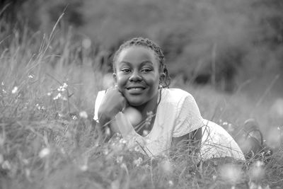 Portrait of smiling girl on field