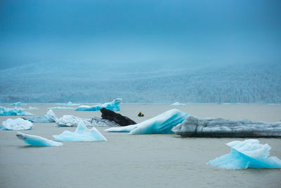 Scenic view of sea against sky during winter