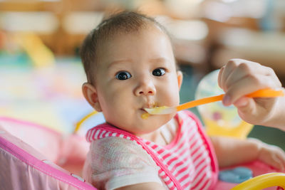 Portrait of cute boy eating food