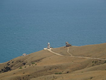 High angle view of land and sea against sky