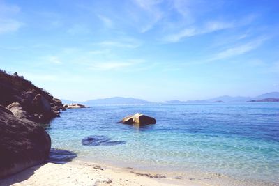 Scenic view of sea against blue sky