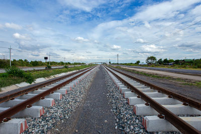 Surface level of railroad tracks against sky