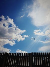 Low angle view of vapor trails in sky