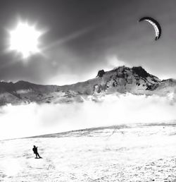 Tourists on snow covered mountain