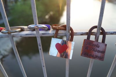 Close-up of padlocks on railing