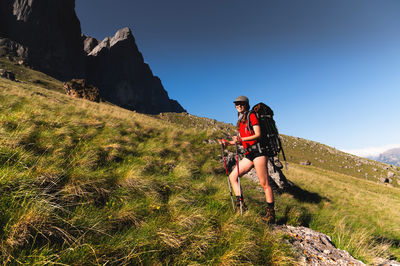Rear view of man standing on mountain