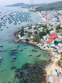 High angle view of townscape by sea