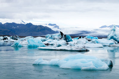 Scenic view of frozen lake against sky