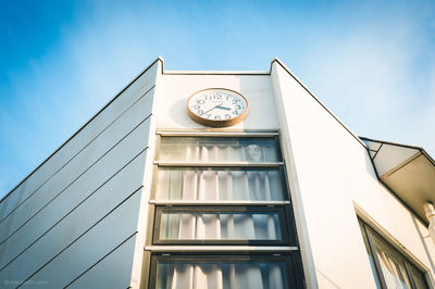 Low angle view of building against blue sky