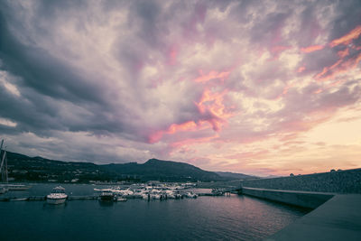 Boats in lake at sunset