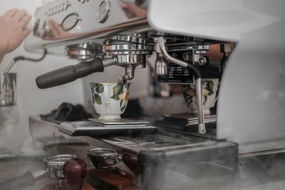 Close-up of pouring coffee in kitchen