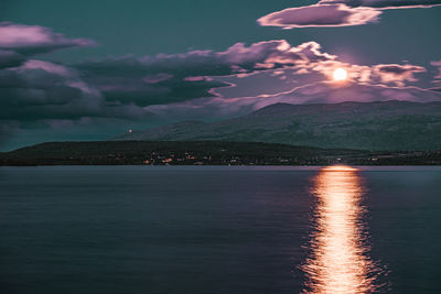 Scenic view of sea against sky at night