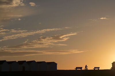 Scenic view of beach against sky during sunset