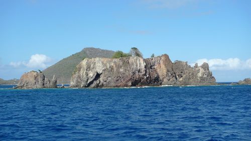 Scenic view of sea with mountains in background