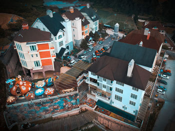 High angle view of illuminated street amidst buildings in city