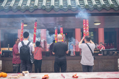 Rear view of people at a temple