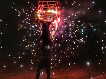 Firework display at night