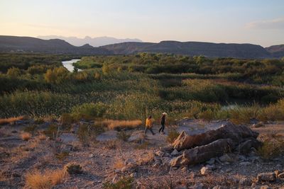 People walking on landscape