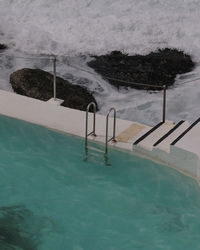 High angle view of swimming pool by sea