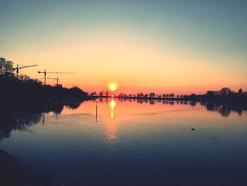 Scenic view of sunset over river