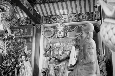 Low angle view of statue against building